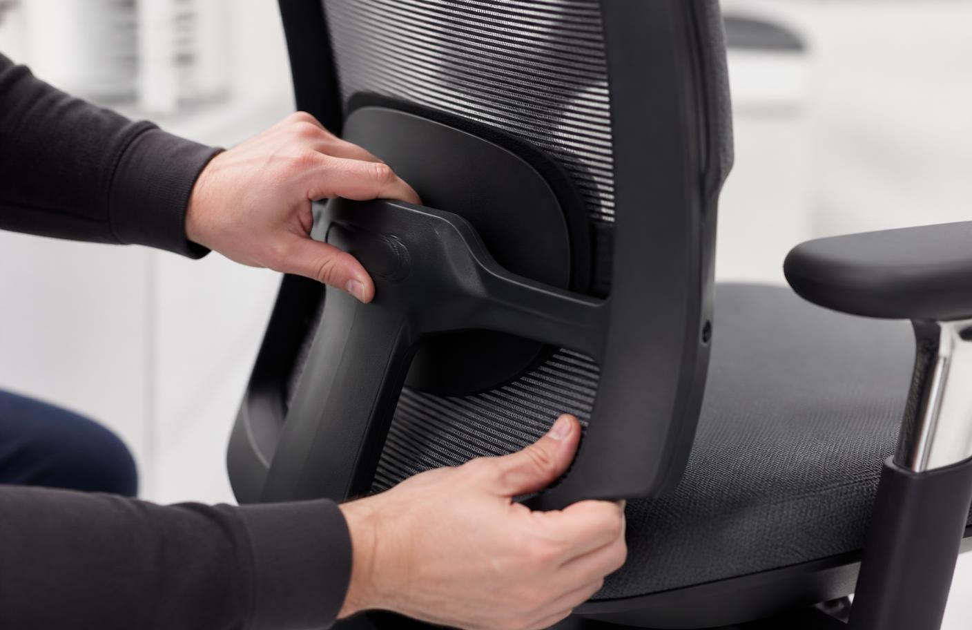 Tester evaluating chair lumbar support